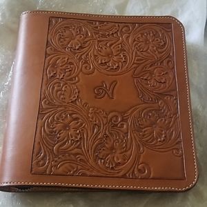 Hand tooled leather notebook.